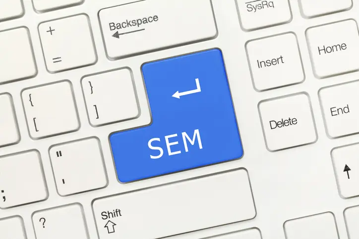 Close-up view on white conceptual keyboard - SEM (blue key)